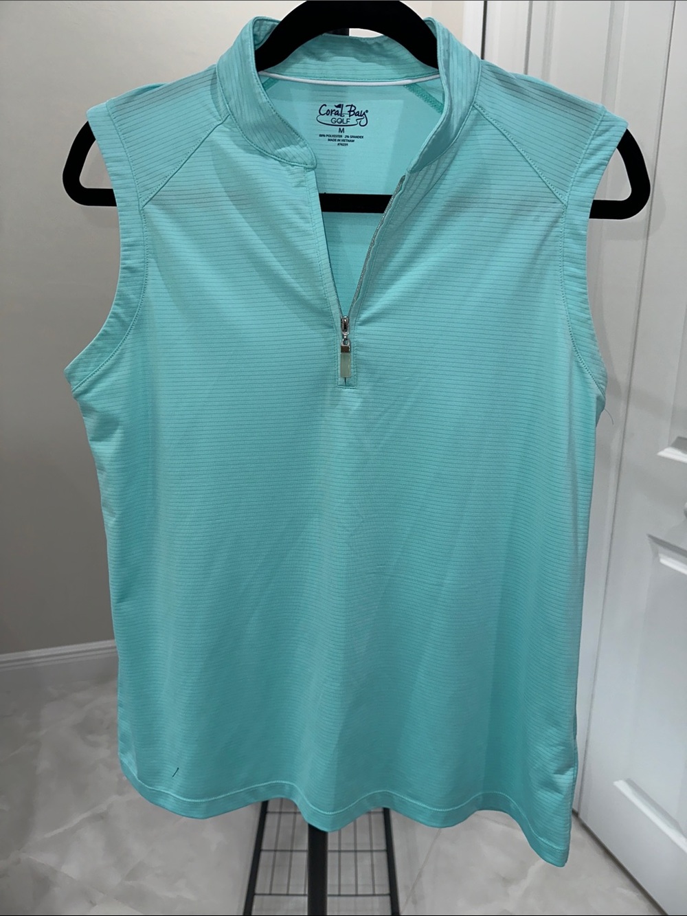 Coral Bay Bundle: White and Blue Sleeveless Zip-Front Golf Polo plus Skort - Picture 4 of 9